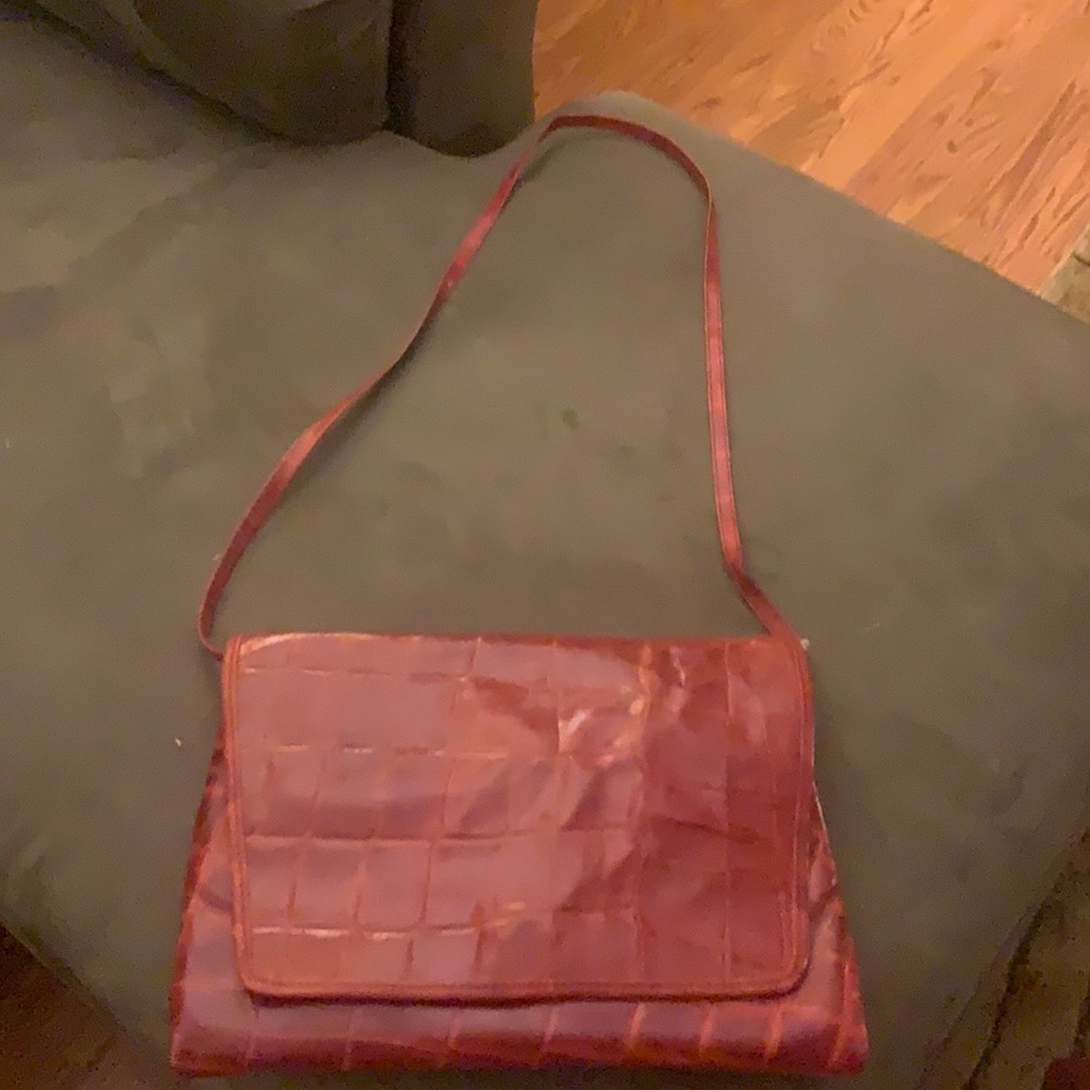 Genuine Leather Purse with strap over the shoulder. Inside all leather .